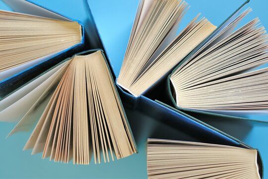 Books on a blue background.Reading of books.Knowledge and Learning Concept. High quality photo