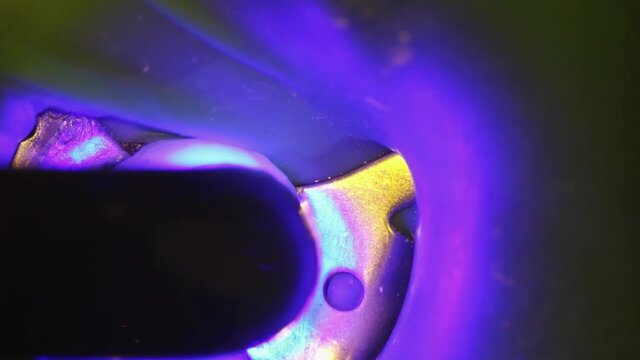 dentistry. shooting with a microscope. dental treatment. a photopolymer lamp shines on the seal
