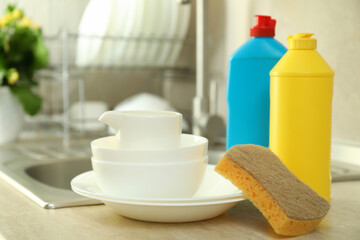 Concept of Dishwashing detergent accessories on kitchen background