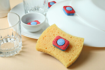 Concept of Dishwashing detergent accessories on beige background