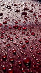 Hydrophobic water effect on red car paint after rain. Water drops on metal surface