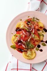 Concept of tasty food with tomato carpaccio on white background