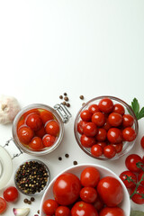 Concept of pickled vegetables with tomatoes on white table