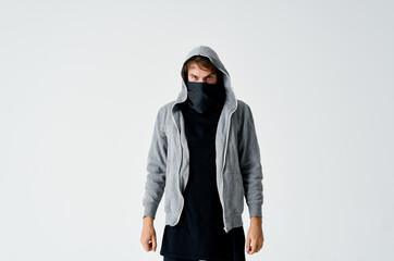 a man in a hood in a mask burglary theft anonymity crime