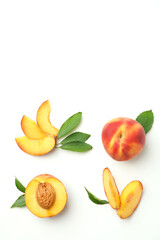 Fototapeta na wymiar Ripe peach fruits with leaves on white background