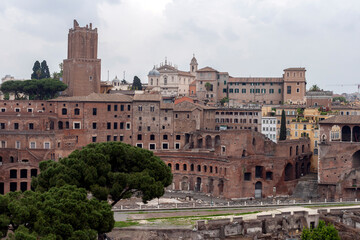 Fototapeta na wymiar The ruins of Trajan's Markets with the Tower of the Militias in Rome