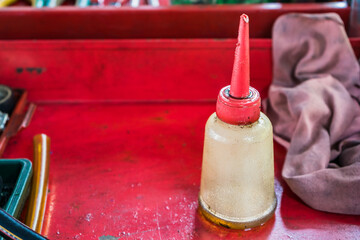 Plastic bottle of universal lubricant oil in the garage