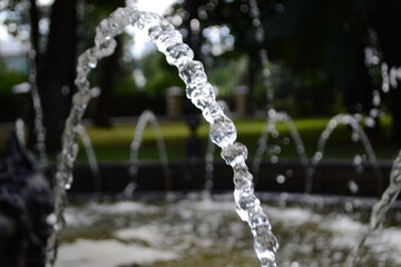 Naklejka na ściany i meble water fountain in the park