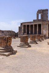 Fototapeta premium Ruins of an ancient city destroyed by the eruption of the volcano Vesuvius, forum with Basilica, Pompeii, Naples, Italy