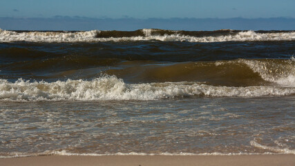 strong waves on the shores of the baltic sea in sunny weather 