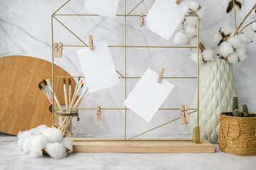 Cards and posters mock ups on grid board. Copy space. Designer hipster painter office table...