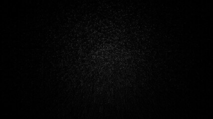Accumulation of particles on a black background. Gray misty noise