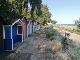 Fototapeta na wymiar Cute colorful small beach huts and houses in Southern Sweden, Ystad
