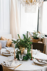 Beautiful table setting for Christmas dinner in Scandinavian style
