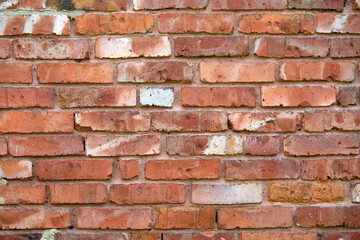 Close-up of an old wall made of red bricks as background. Seen in Germany in July.