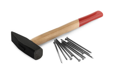 Hammer and metal nails on white background