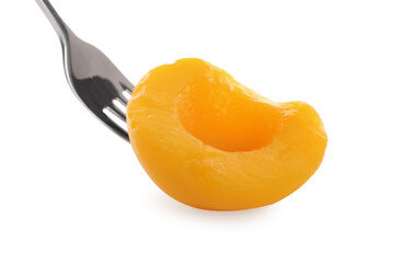 Sweet juicy canned peach half isolated on white
