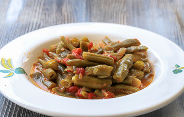 Traditional delicious Turkish foods; green beans with olive oil (Zeytinyagli fasulye) - Powered by Adobe