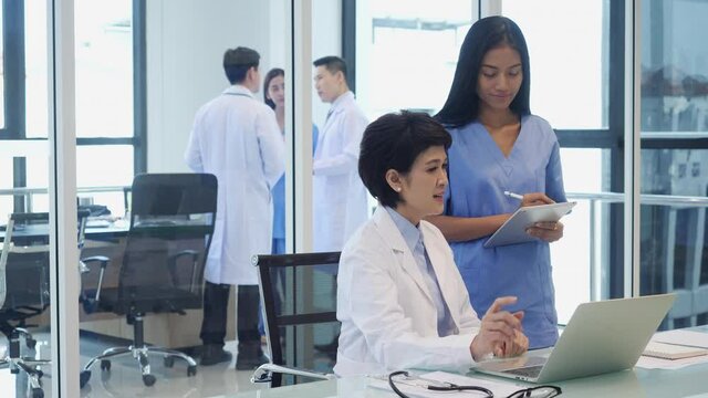 Doctor brainstorming examination of the symptoms patient at meeting room. Medical team presenting symptoms of patient at hospital.
