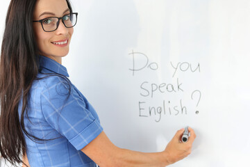 Lettering do you speak english on white board closeup