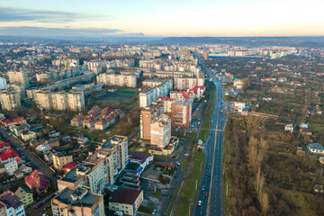 High rise apartment buildings and streets with traffic in city residential area.