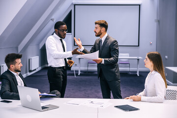 Angry executive manager fires incompetent african american emplo