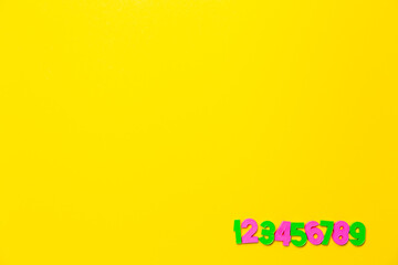 Numbers set 1 2 3 4 5 6 7 8 9. Copy space. Colorful plastic numerals isolated on yellow background. Preschool distance education banner. Math online course. Funny count. Primary school. Card
