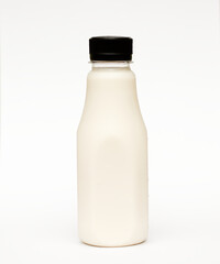 Milk in bottle white background.