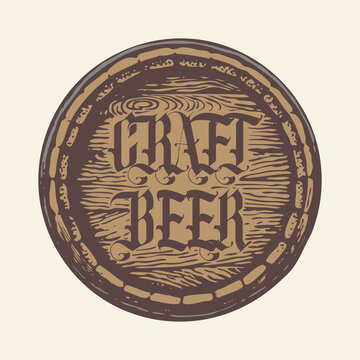 Vector label or sticker for craft beer in the form of a wooden barrel lid with a decorative inscription in vintage style on a light background. Suitable for a beer pub and brewery design element