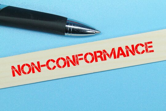 pen, a stick of colored ice cream with the word non-conformance