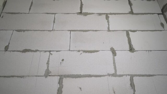 White brick wall texture background for a block of stone tiles. White block wall. White blocks.