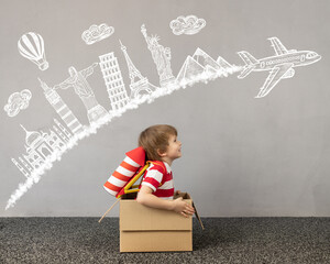 Child playing in cardboard box © Igor Yaruta