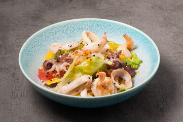 salad with squid, octopus, shrimp and vegetables