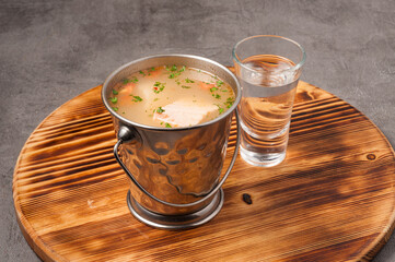 traditional Russian fish soup with salmon pike perch and vodka