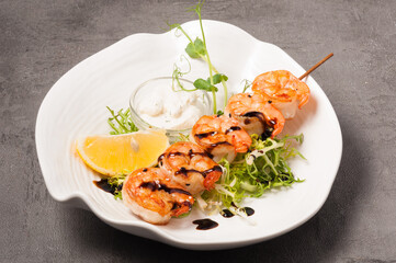 royal shrimp on a skewer with cream sauce