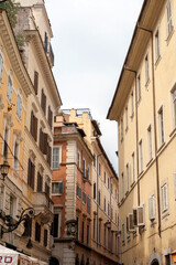 Fototapeta na wymiar Buildings on a summer street in Rome