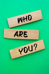 Who are you? question written wooden blocks.