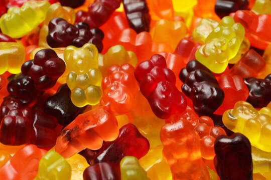 Delicious gummy bear candies as background, closeup