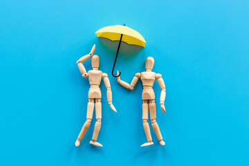 Couple of wooden figures - man and woman connection. Love and dating concept