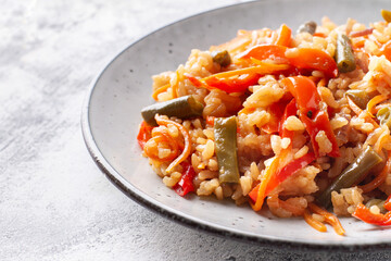 Rice wok with vegetables in a plate