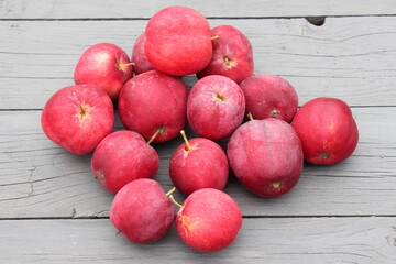 red apples on a wooden background