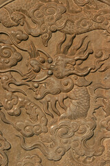 bas-relief with a sculpted dragon at the phuoc kien pavilion in hoi an in vietnam 