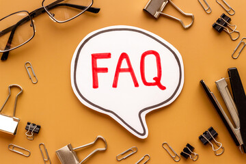 Word faq frequently asked questions with stationery on working place