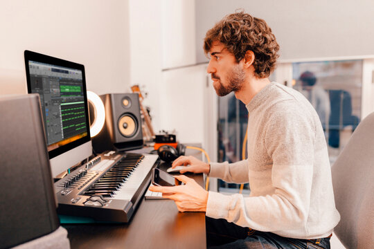Music producer working at home music studio