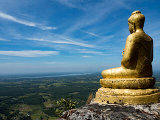 Fototapeta na wymiar Budda on top moutain. Phu Langka National Park in the Bueng Khong Long District of Bueng Kan Province, Thailand.