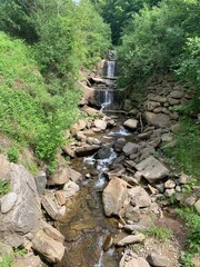 Weinebene, Austria June 24, 2021. Waterfall in the mountains 