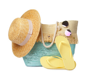 Stylish bag with beach accessories isolated on white