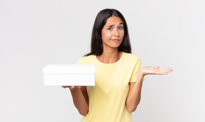 young hispanic woman feeling puzzled and confused and doubting