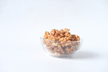 a bowl of walnut on white background 