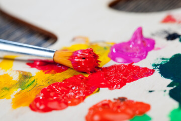 Obraz premium mixed on a wooden palette of multi-colored paints
